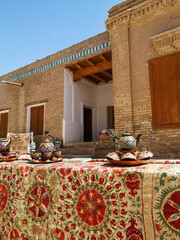Traditional Uzbekh tea sets and carpets on the street market