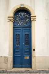 Cast iron decoration on the door of a closed house in Faro, Algarve, Portugal