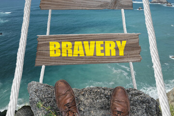 Bravery sign for courage concept on a dangerous bridge.