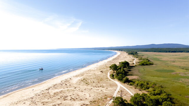 Drone view of a small fishing boat in the sea. Forest, beach and sea. Natural beauties of Igneada.