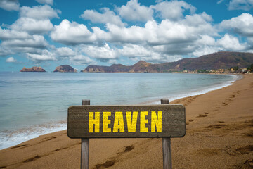 Sign with the word Heaven at the beach.