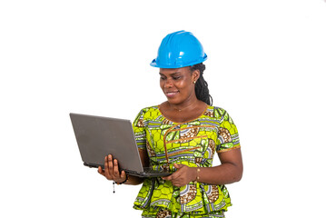 female engineer working on laptop computer smiling.