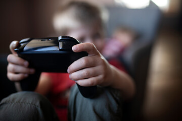 Child holding video game remote