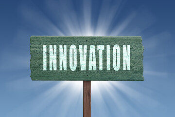 Innovation sign on sky background with sun rays.