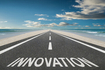 Fototapeta premium Innovation written on a beach highway leading to the future.