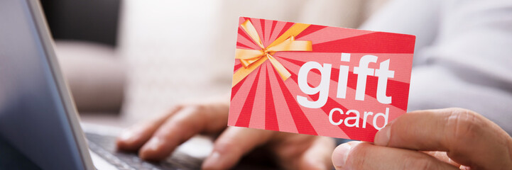 Human Hand Holding Gift Card