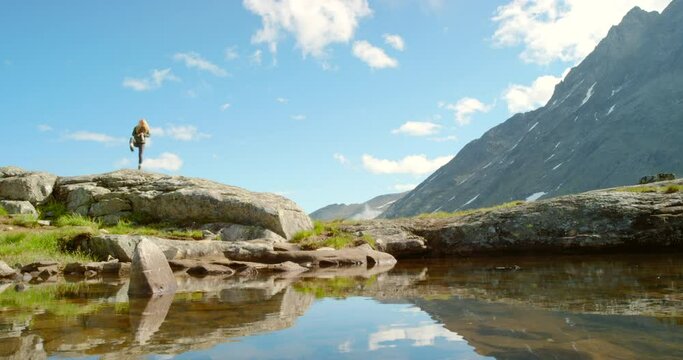 4k video footage of an unrecognisable woman dancing with excitement while exploring the mountains in Mre og Romsdal