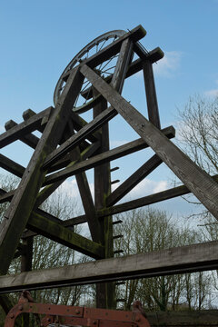 from below wooden mining rig and mining head wheel