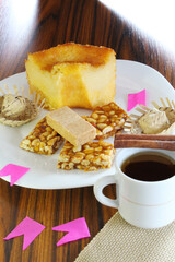 June party Brazil with cake sweets and coffe with cinnamon under window ligh. Seletive focus.
