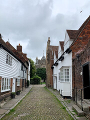 Fototapeta na wymiar West street view in Rye East Sussex Charming medieval street in old town Picturesque countryside. Street leading to Church of Saint Mary, Rye. UK, England, United Kingdom. Summer in Rye. Architecture,