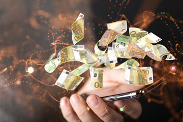 euro bills flying around  in hand