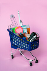 Mini grocery cart with stationery. Selective focus .Back to school shopping for stationery. 