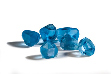 Real natural topaz blue gemstone crystals on white
