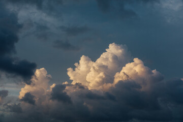 Dramatic puffy bright and dark clouds over the ocean