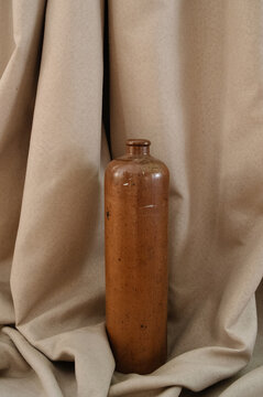 unusual clay vase against a white canvas