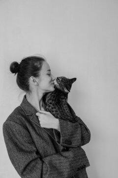 Black and white portrait of a girl with a cat