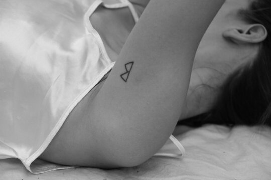 The girl is lying in her underwear . the details of the hands and neck