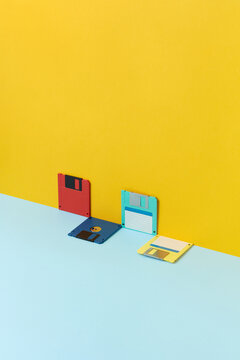 Four floppy disks of over duotone background