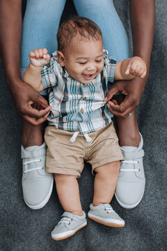 Baby Squirms as Mother Affectionately Tickles Him