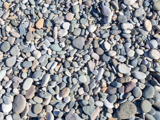 Lots of rubble. Pebble coast. Background from pebbles.