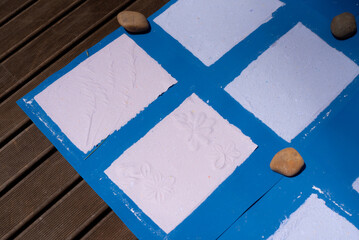 Finished and dried paper with embossed decor