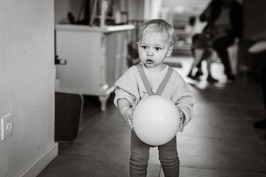 Picture of a sweet baby holding a balloon