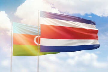 Sunny blue sky and flags of costa rica and azerbaijan