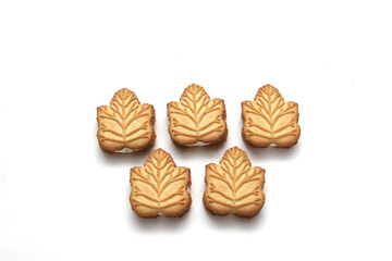Delicious cookies filled with vanilla cream made with honey or maple syrup from Canadian trees, the traditional sweet of Canada on a white background	