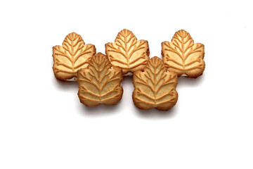Delicious cookies filled with vanilla cream made with honey or maple syrup from Canadian trees, the traditional sweet of Canada on a white background	