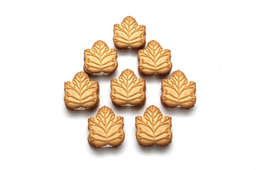 Delicious cookies filled with vanilla cream made with honey or maple syrup from Canadian trees, the traditional sweet of Canada on a white background	