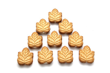 Delicious cookies filled with vanilla cream made with honey or maple syrup from Canadian trees, the traditional sweet of Canada on a white background	