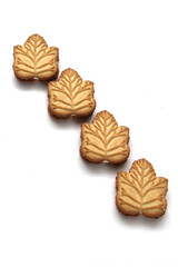 Delicious cookies filled with vanilla cream made with honey or maple syrup from Canadian trees, the traditional sweet of Canada on a white background	