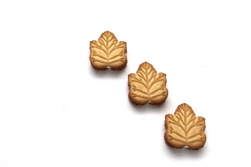 Delicious cookies filled with vanilla cream made with honey or maple syrup from Canadian trees, the traditional sweet of Canada on a white background	