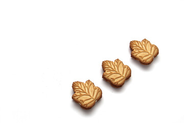 Delicious cookies filled with vanilla cream made with honey or maple syrup from Canadian trees, the traditional sweet of Canada on a white background	