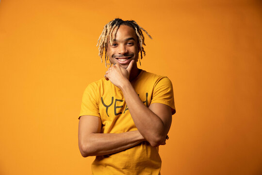 Young Man Smiles at Camera Wearing Motivational Shirt