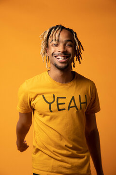 Happy Model in Motivational Shirt Smiles at Camera