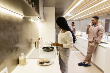 Family routine in evening at kitchen 