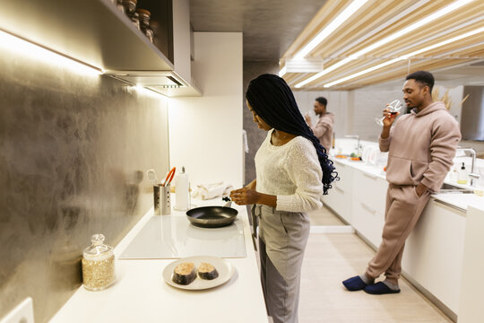 Family routine in evening at kitchen 