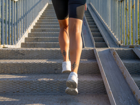 crop fitness legs climbing up stairs