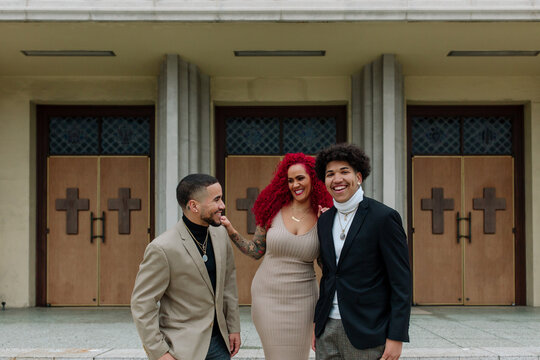 Red-haired mom and sons in front of church
