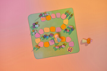 Colorful play figures with dice on board