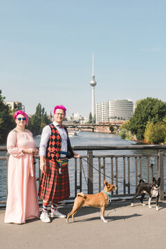 Alternative couple walking their dogs in Berlin