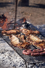 Outdoor Barbecue Different kinds of meat on a charcoal grill.
