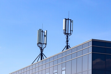 4G 5G GSM cellular transmitter ans signal repeater antenna on a roof © Aguus