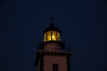 The head of lighthouse at night.