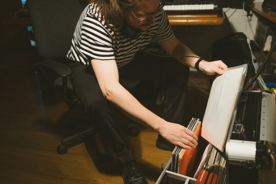 Young men looking at vinyl records