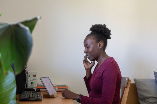 freelancer, portrait of woman calling by phone at home