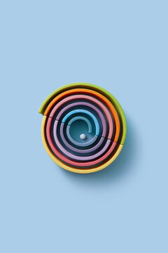 Rounded colorful wooden planks with ball in studio