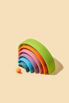 Arch shaped construction of wooden planks with small ball