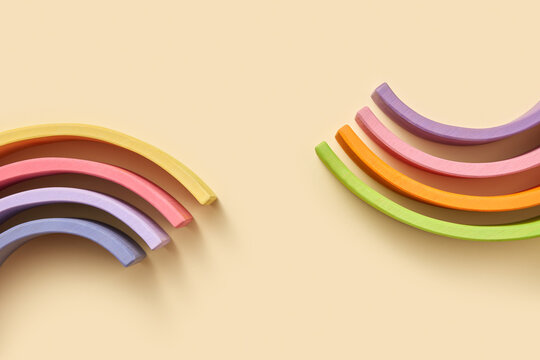 Curved wooden hemispheres of on beige background